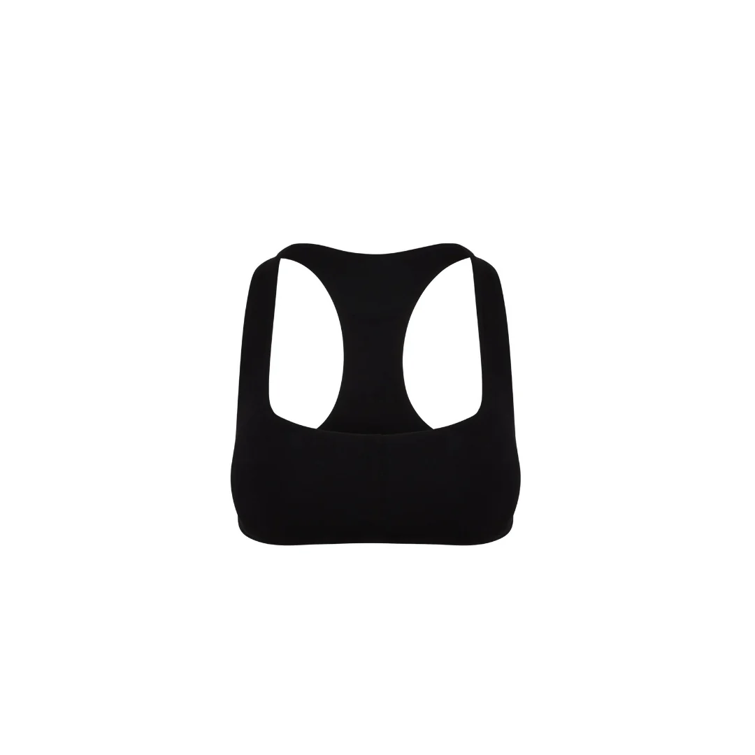 Freigestellter Core Calm Seamless Bra in Schwarz, Vorderansicht – nahtloser Sport-BH mit Racerback, auf weißem Hintergrund.